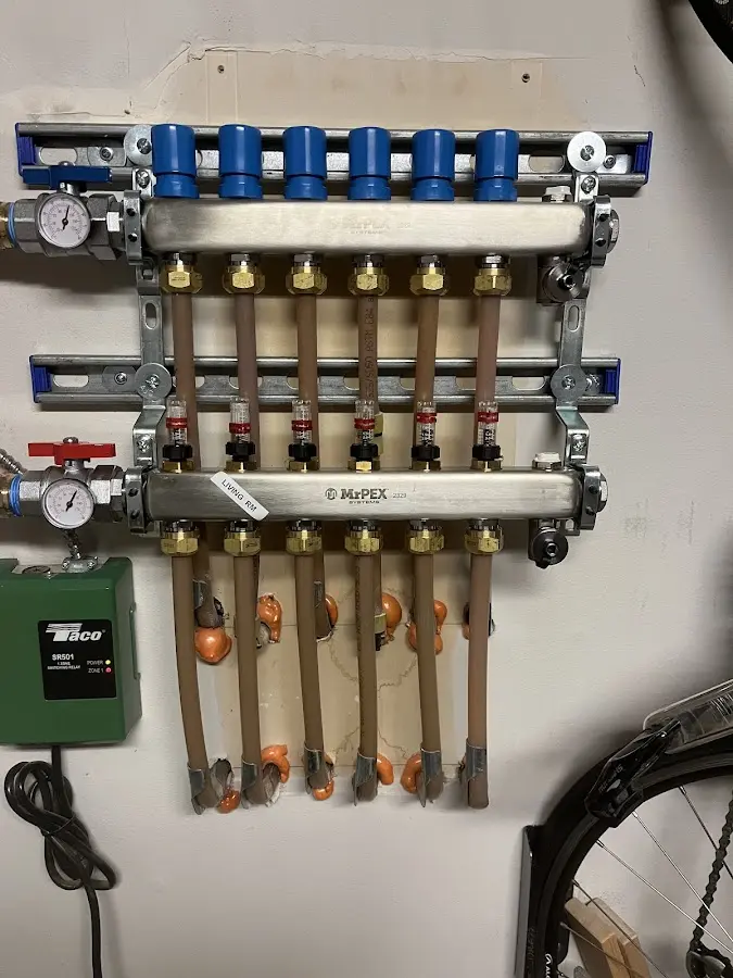 Plumber performing Water Heater Repair at a residential property in Washington