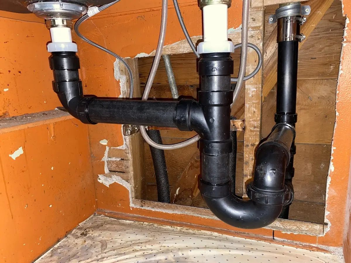 Professional Garbage Disposal Repair equipment and tools on the job in Washington